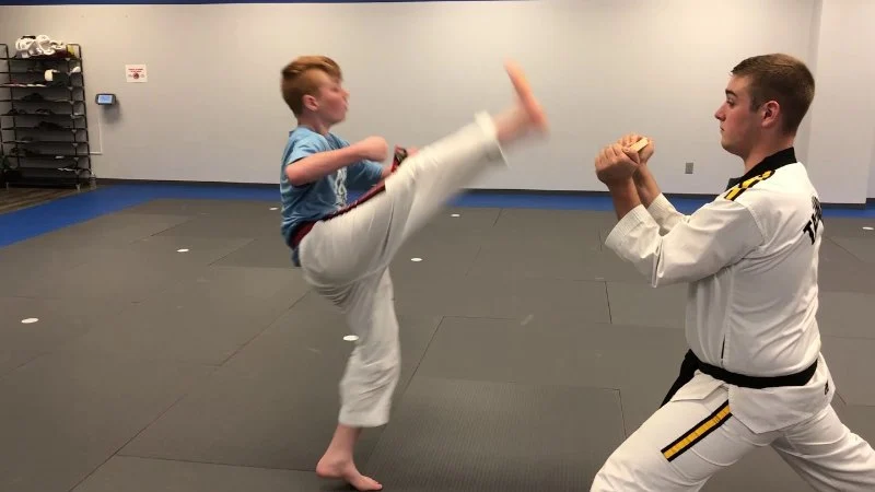 How to Execute a Jumping Axe Kick for Breaking Competitions