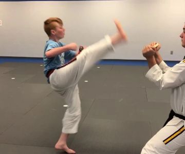 How to Execute a Jumping Axe Kick for Breaking Competitions